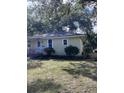 Cozy single-level home with manicured landscaping and shade trees on a green lawn at 2636 S Allen Dr # 2559 Accabee A & B, North Charleston, SC 29405