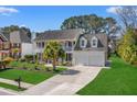 Charming two-story home featuring a double-decker porch, manicured lawn and a two car garage at 2900 Colonnade Dr, Mount Pleasant, SC 29466
