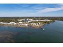 Breathtaking aerial view of a waterfront community with lush greenery and stunning waterways at 3019 Eventide Dr, Johns Island, SC 29455