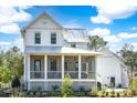 The rear exterior shows a charming screened porch and metal roof under a bright sky at 3019 Eventide Dr, Johns Island, SC 29455