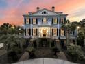 Elegant two-story home featuring symmetrical design, manicured landscaping, and inviting entryway at 3232 Pignatelli Cres, Mount Pleasant, SC 29466