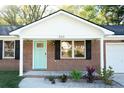 Inviting front entrance with a newly painted light blue door and fresh landscaping at 380 Furman Ln, Ladson, SC 29456