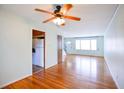 Inviting living room featuring hardwood floors, neutral walls, and a ceiling fan at 7 Doughty St # C, Charleston, SC 29403