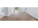 Bright and airy living room featuring modern flooring, access to the backyard, and an open layout at 1044 Forrest Creek Dr, Summerville, SC 29483