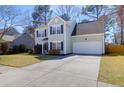 View of home with well-maintained lawn, driveway, and attached one car garage at 105 Thousand Oaks Cir, Goose Creek, SC 29445