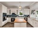 Elegant kitchen with custom cabinets, modern appliances, and a center island, perfect for cooking and entertaining at 1126 Ocean Forest Lane, 1/8 Share, Seabrook Island, SC 29455