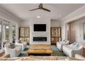Bright living room with fireplace, designer accents, and ample seating, creating a warm and inviting space at 1126 Ocean Forest Lane, 1/8 Share, Seabrook Island, SC 29455