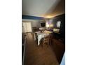 Inviting dining room with hardwood floors, a large table, and a piano at 1770 Skinner Ave, Charleston, SC 29407