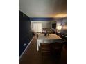 Inviting dining room with hardwood floors, a large table, and a piano at 1770 Skinner Ave, Charleston, SC 29407