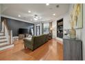 Spacious living room with hardwood floors and elegant dark accent wall at 204 Branch Creek Trl, Summerville, SC 29483