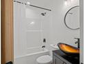 This bathroom boasts modern fixtures and a unique vessel sink on a vanity cabinet at 2124 Booker St, Charleston, SC 29405