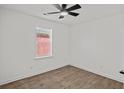 This bedroom features modern flooring, a window, and plenty of open space at 2124 Booker St, Charleston, SC 29405