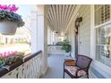 Covered front porch with a seating area, lantern, and view of the neighborhood at 2416 Kings Gate Ln # 403, Mount Pleasant, SC 29466