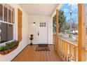 Inviting front porch with decorative flower box and 'hello' welcome mat at entry at 2714 W Surrey Dr, North Charleston, SC 29405