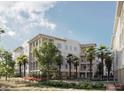 Elegant condo building with multi-level balconies, lush landscaping, and a serene walkway with benches at 325 Longshore St # 1143, Daniel Island, SC 29492