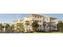 Charming condo building with multiple levels of balconies, surrounded by trees, plants, and landscaping at 325 Longshore St # 1143, Daniel Island, SC 29492
