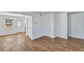 Bright living area features wood-look floors, white walls, and natural light from large windows at 415 Parkdale Dr # 12 A, Charleston, SC 29414