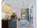 Bright entryway with hardwood floors, stylish decor, and a view of the front door at 1104 Old Course Ln, Mount Pleasant, SC 29466