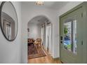 Stylish foyer with an arched doorway, hardwood floors, and a glimpse into the living space at 1228 Penny Cir, Mount Pleasant, SC 29464