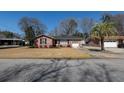 Classic brick home with a single-car garage, complemented by a well-kept lawn, and a traditional suburban setting at 1258 Redeemer Dr, Hanahan, SC 29410