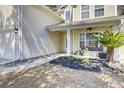 Inviting front porch with outdoor seating and decorative plants at 126 Moon Shadow Ln, Summerville, SC 29485