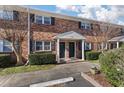 Charming brick exterior of townhome featuring landscaped front yard and covered entrance at 1836 Mepkin Rd # D4, Charleston, SC 29407
