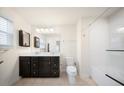Bright bathroom featuring double sinks, a large mirror, and a shower over tub combo at 200 Silver Palm Ln, Summerville, SC 29485
