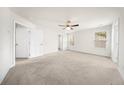 Spacious, light-filled bedroom with plush carpeting, ceiling fan, and windows at 200 Silver Palm Ln, Summerville, SC 29485