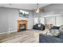 Spacious living room featuring a fireplace, modern furnishings, and a ceiling fan at 203 Birmingham Dr, Summerville, SC 29486