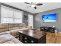 Comfortable living room with a large sectional sofa, hardwood floors, and a ceiling fan at 2236 Pinehurst Ave, Charleston, SC 29414