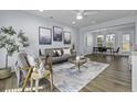 Bright living room features stylish furniture, contemporary decor, and wood-look flooring at 2280 Bailey Dr, Charleston, SC 29405