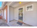 Covered entryway featuring a glass door, neutral siding, and a welcoming doormat at 234 Darcy Ave, Goose Creek, SC 29445