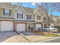 Inviting townhome showcasing brick accents, attached garages, and lovely curb appeal at 234 Darcy Ave, Goose Creek, SC 29445