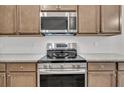 Modern range and microwave with stainless steel appliances, and ample cabinet space at 419 Grove End Rd, Moncks Corner, SC 29461