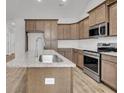 Modern kitchen featuring granite countertops, stainless steel appliances, and ample cabinet space at 419 Grove End Rd, Moncks Corner, SC 29461