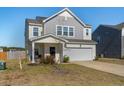 Attractive two-story home with gray and white siding, and a two-car garage at 458 Pender Woods Dr, Summerville, SC 29486