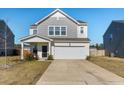 Charming two-story home featuring a covered porch and an attached two-car garage at 458 Pender Woods Dr, Summerville, SC 29486