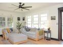 Bright and airy living room features large windows, modern furnishings, and ample natural light at 5273 Potomac St, North Charleston, SC 29405