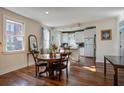Open concept dining room and kitchen with hardwood floors and lots of light at 757 King St, Charleston, SC 29403