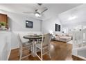Charming dining area featuring a round table, wood floors, and modern ceiling fan at 8618 Grassy Oak Trl, North Charleston, SC 29420