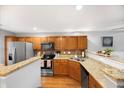 Well-equipped kitchen with granite countertops and stainless steel appliances at 8618 Grassy Oak Trl, North Charleston, SC 29420