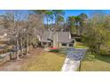 Charming single-Gathering home with a well-maintained lawn and inviting entrance at 100 Traders Station Rd, Summerville, SC 29486