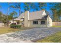 Charming single-Gathering home with a well-maintained lawn and inviting entrance at 100 Traders Station Rd, Summerville, SC 29486