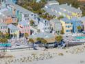 Aerial view of colorful beachfront community with pool, club house and beach access at 129 Grand Pavilion Blvd, Isle of Palms, SC 29451