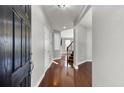 Welcoming foyer with gleaming hardwood floors and staircase at 138 Back Tee Cir, Summerville, SC 29485