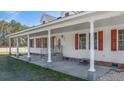 Covered front porch with stone columns, creating a welcoming entrance to the home at 1677 French Santee Rd, Jamestown, SC 29453