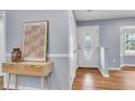 Stylish entryway with console table and decorative mirror, leading to the main living area at 1723 River Front Dr, Charleston, SC 29407