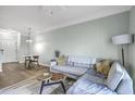 Inviting living room with a dining area and a comfortable sofa, perfect for relaxing at 1755 Central Park Rd # 7203, Charleston, SC 29412