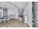 Open foyer featuring wood-look floors, light blue walls, and stylish furnishings at 201 Garden Lily Lane, Summerville, SC 29485