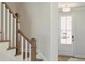 Open entryway with staircase and view to the front door and exterior at 215 Abercom Place Dr, Moncks Corner, SC 29461